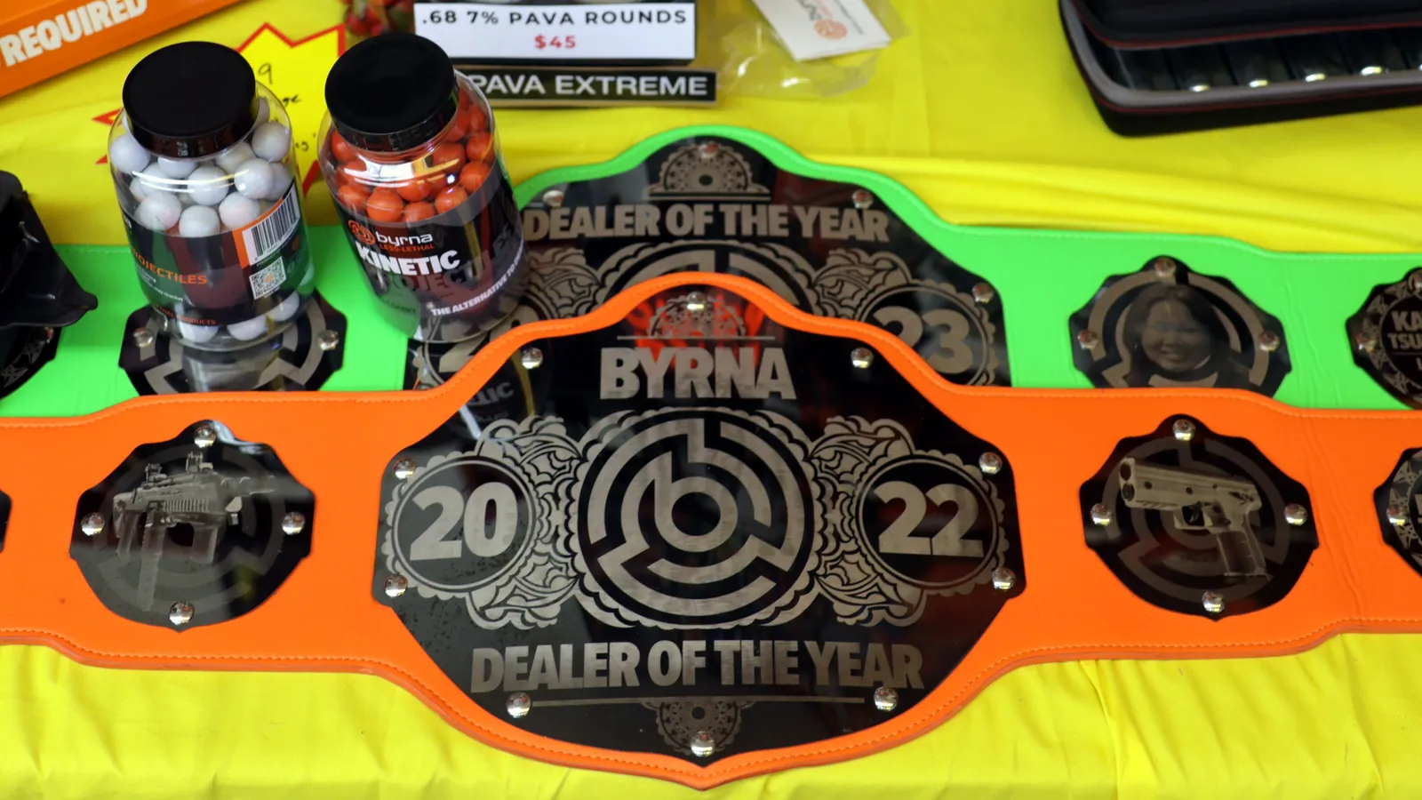 Byrna Dealer of the Year championship belts displayed in the shop
